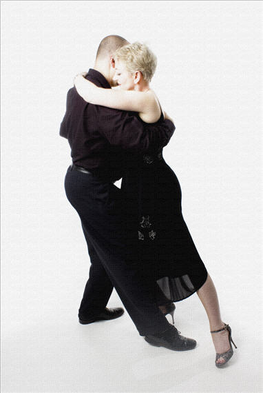 David and Ann in a soft tango lunge, white studio backdrop
